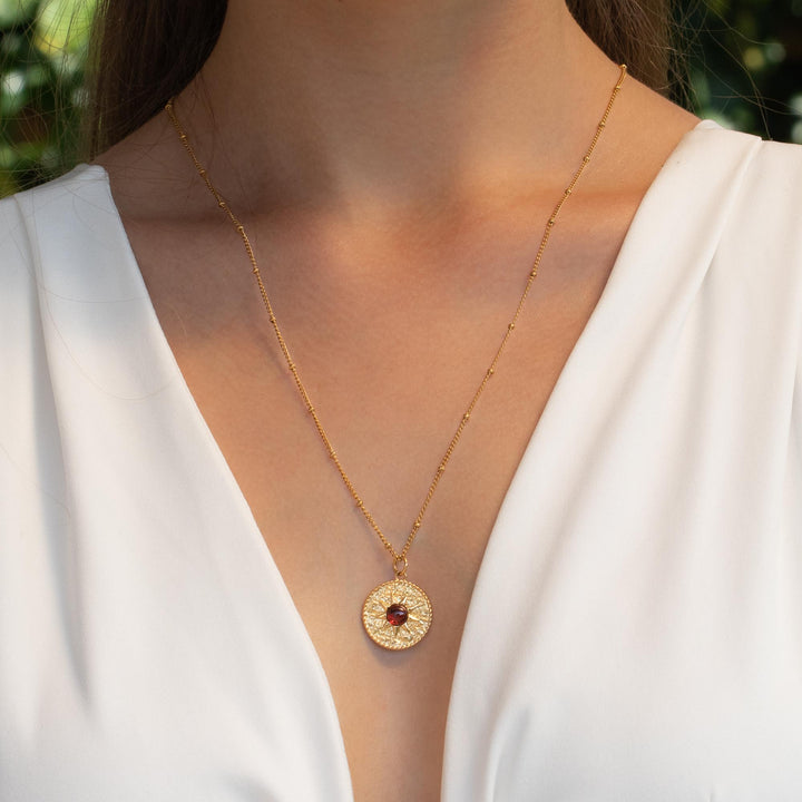 Gold Sun Necklace with Garnet